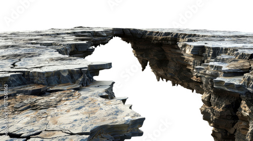 Bridging the Divide: A rugged rock formation with an opening, inviting contemplation on the beauty of natural erosion and the interplay of light and shadow.