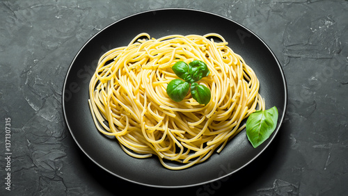 Dark plate with italian spaghetti on dark.