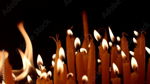 Burnng candles shot in slow motion - ending up with over blowing fire of the last candles - camera dolly movement