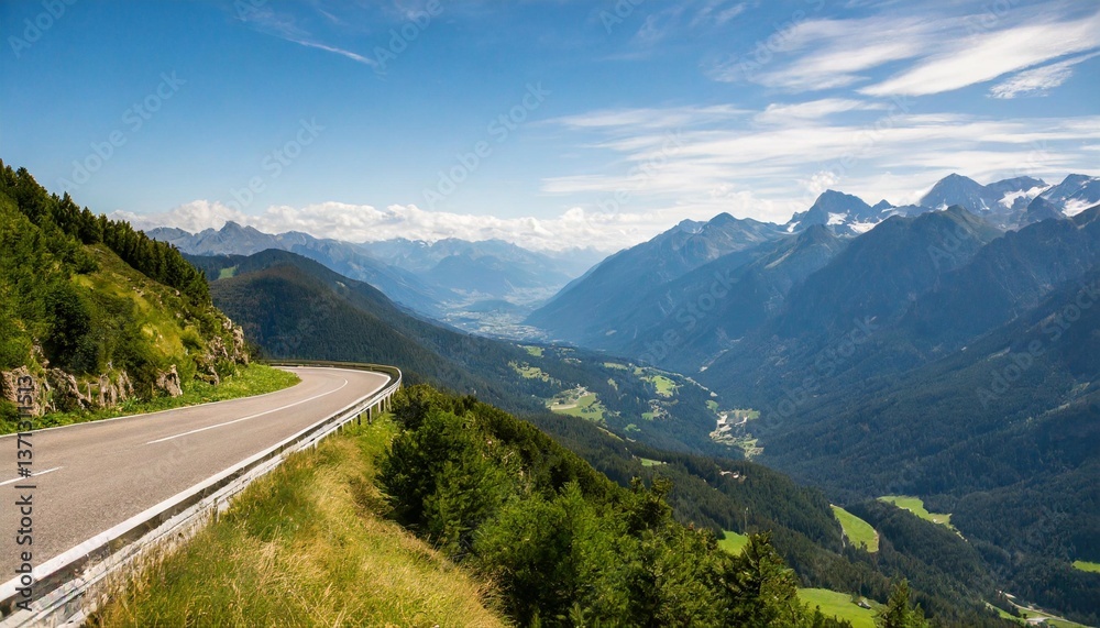 Naklejka premium Roads Twisting Through Mountains Leading to Valleys Green and Far Below