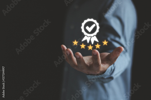 Businessman show best quality assurance with golden star. Quality control certificate and standardization. ISO service approval concept. Client support guarantee evaluation, product value improvement.