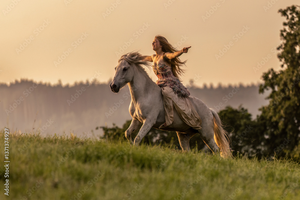 A female equestrian and her horse interacting together. Romantic freedom sunset scene