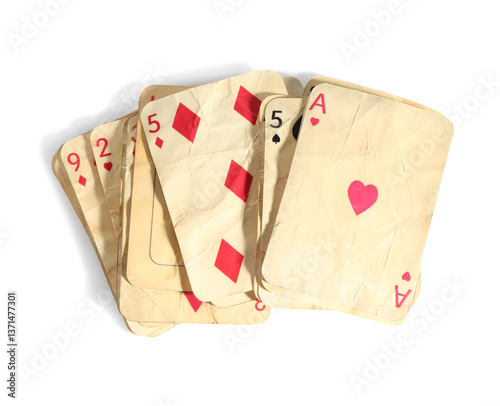 Old vintage playing cards isolated on white, top view
