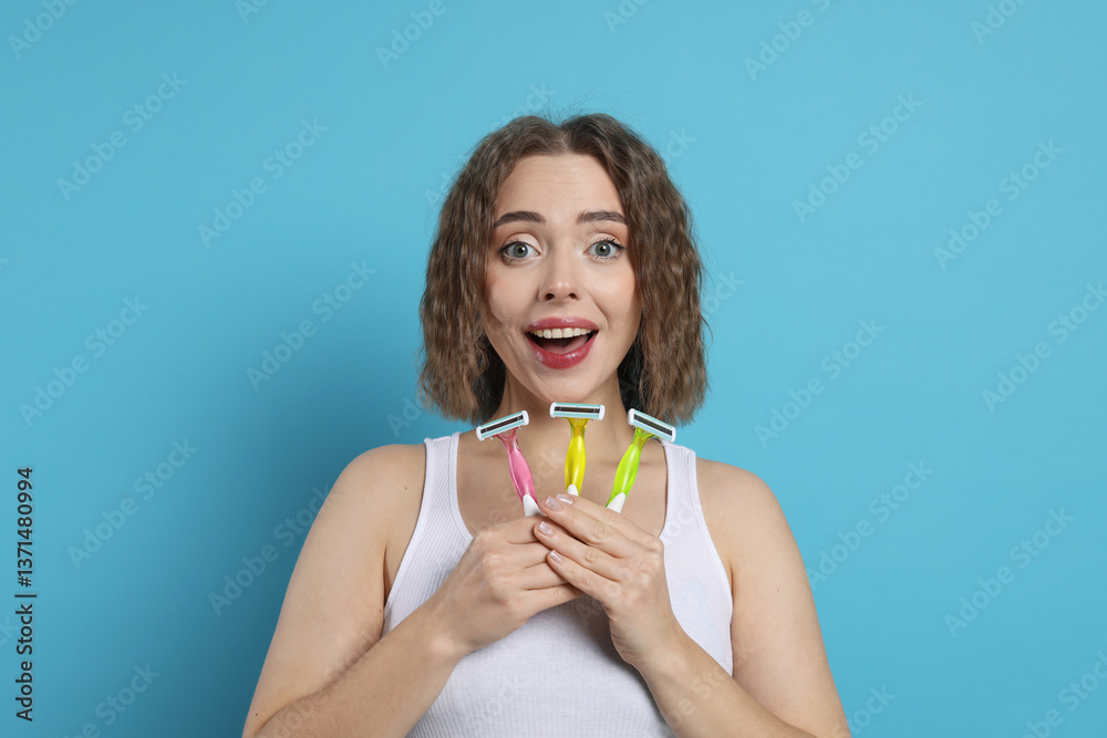 Emotional woman with different razors on light blue background. Hair removal tools Emotional woman with different razors on light blue background. Hair removal tools