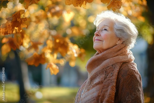 Elderly Woman in Serene Park Surrounded by Autumn Foliage Reflecting on Memories