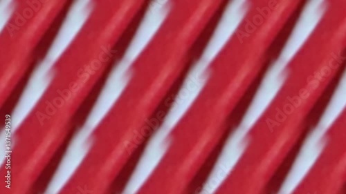 an abstract pattern of red and white stripes, creating a dynamic and visually interesting composition. The bold colors and diagonal lines create a sense of movement and energy