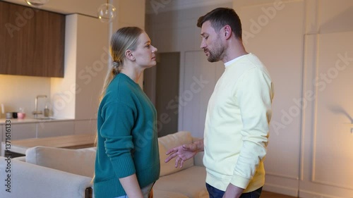 Angry disgusted wife pushes away lying husband, overwhelmed by deception. Rejection, couple turmoil, trust shattered, painful conflict, relationship breakdown, betrayal, irreparable damage, heartbreak