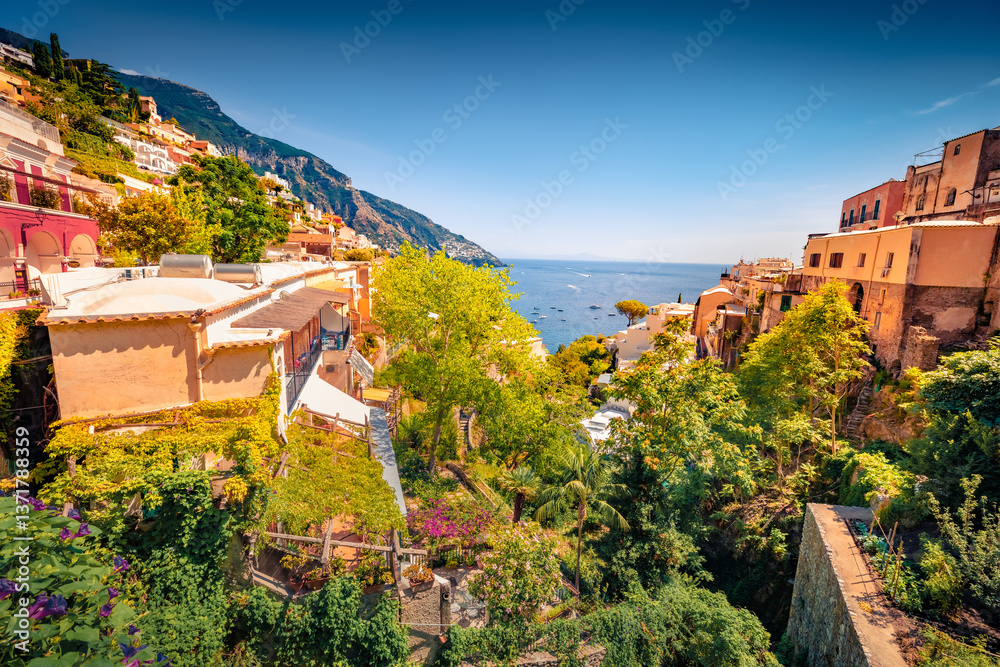 Colorful summer cityscape of cliffside resort on southern Italy's Amalfi Coast - Positano. Wonderful morning seascape of Mediterranean sea. Traveling concept background.