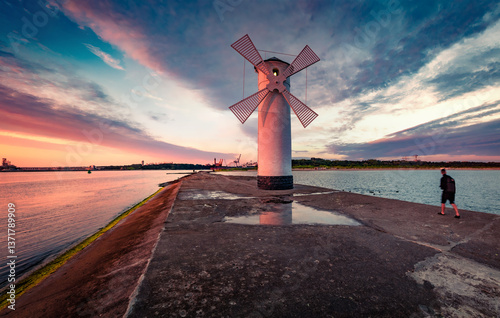 Obraz na płótnie Calm summer scene of Stawa windmill. Colorful sunrise on Szczecin Lagoon. Superb morning seascape of Baltic Sea, Swinoujscie, Western Pomerania, Poland, Europe. Traveling concept background.. w salonie
