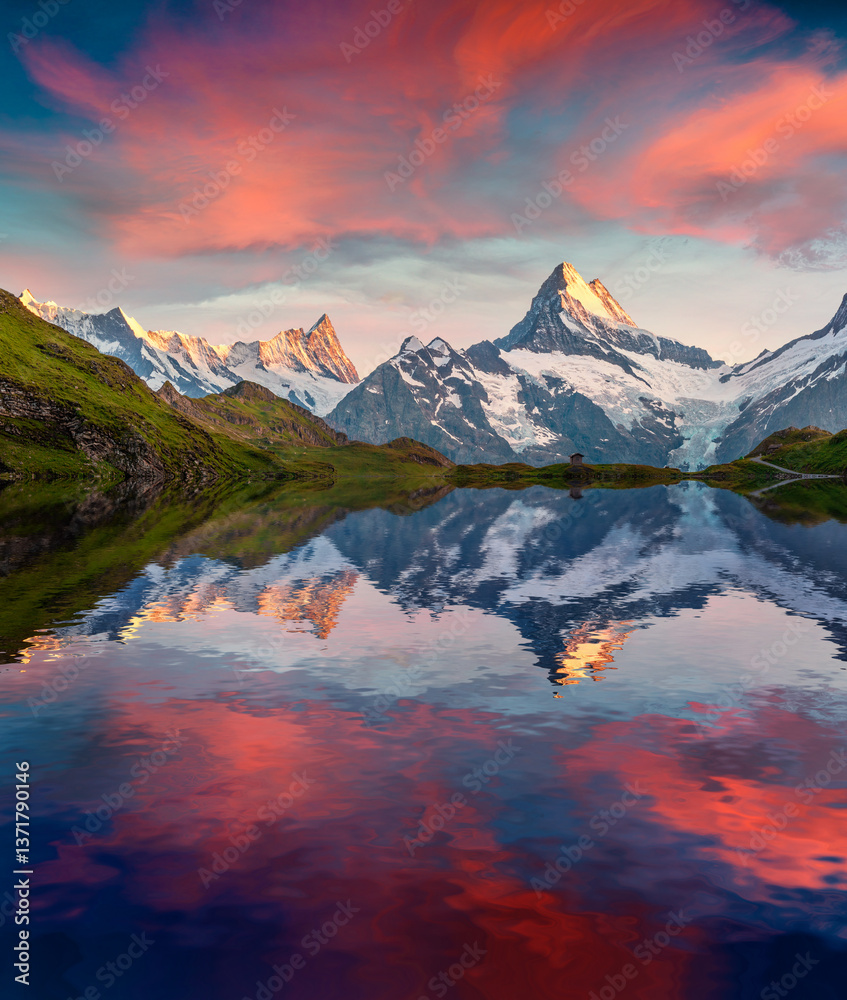 Wetterhorn peak reflected in water surface of Bachsee lake