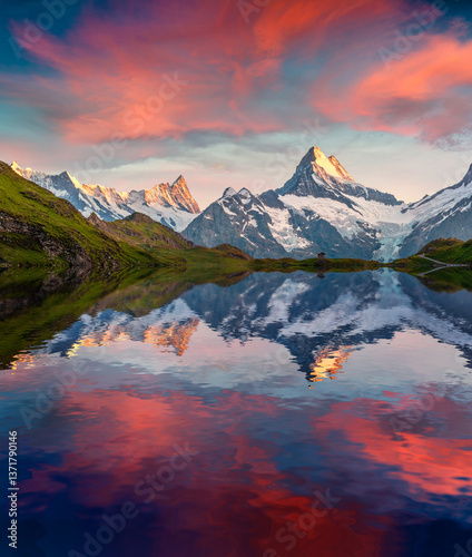 Obraz na płótnie Wetterhorn peak reflected in water surface of Bachsee lake w salonie