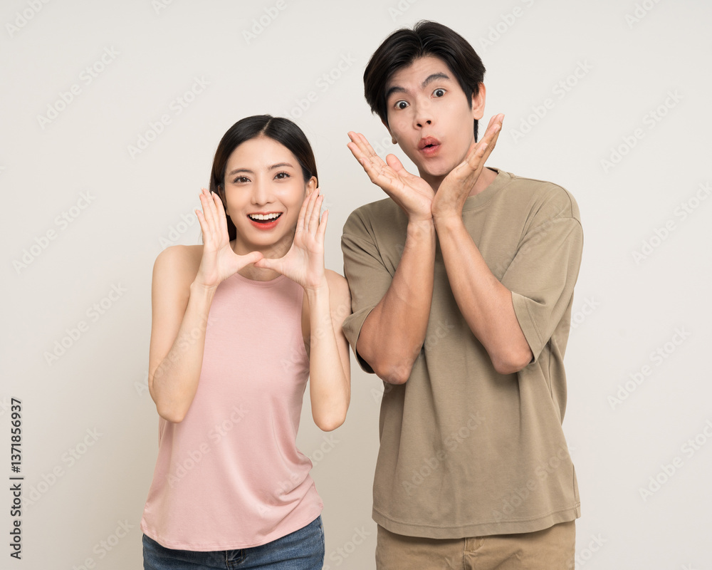Hands open palm up Happy asian couple attractive in various action gesture standing on isolated white background. Cheerful Smiling young man and woman showing hands and wow excited Hands open palm up Happy asian couple attractive in various action gesture standing on isolated white background. Cheerful Smiling young man and woman showing hands and wow excited