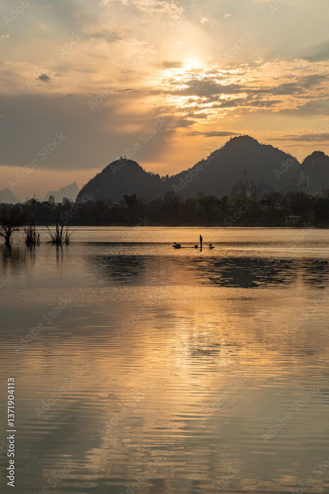 Fototapeta premium Celestial Dawn on Li River: Golden Mist Rising Between Emerald Karst Peaks – Guilin's Living Watercolor Masterpiece