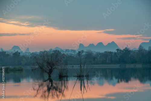 Golden Dawn on Li River: Misty Karst Peaks Reflecting in Mirror-Still Waters – Guilin's Ethereal Morning Symphony