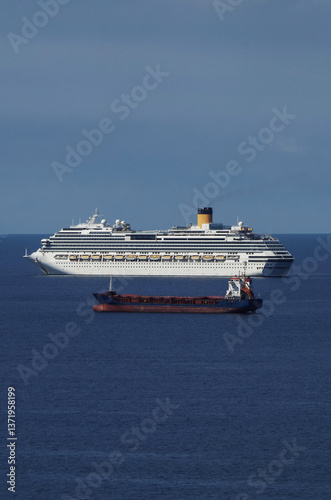 Obraz na płótnie Mega family cruiseship cruise ship liners Favolosa and Fortuna anchored offshore of Civitavecchia Rome, Italy before reactived after Covid pandemic with other vessels in port and coastline w salonie