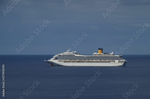 Obraz na płótnie Mega family cruiseship cruise ship liners Favolosa and Fortuna anchored offshore of Civitavecchia Rome, Italy before reactived after Covid pandemic with other vessels in port and coastline w salonie