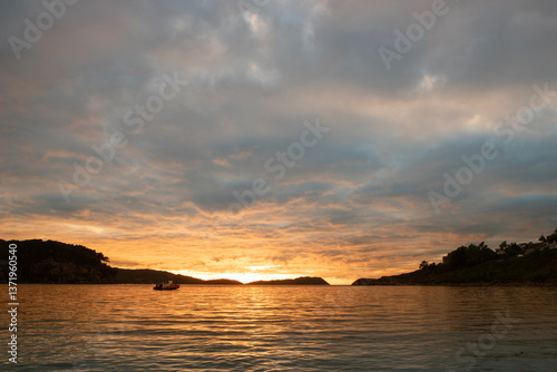 Sunset at a loch near a camping site in Sheildaig, Scotland.