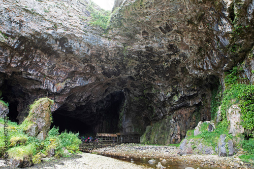 The entrance to Smoo cave located along the N500 route. photo