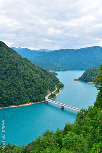 Bridge over lake Piva reservoir from Piva canyon viewpoint. Beautiful Montenegro nature landscape, explore the Balkans, travel Europe.