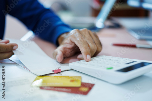 Wallpaper Mural asian man calculate monthly expenses from receipt and many bill of various expenses after spending via credit card and must be pay back soon Torontodigital.ca