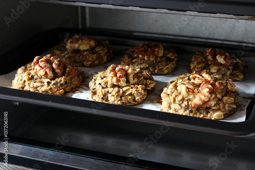 Homemade oat and banana cookies in the oven, dessert for vegan