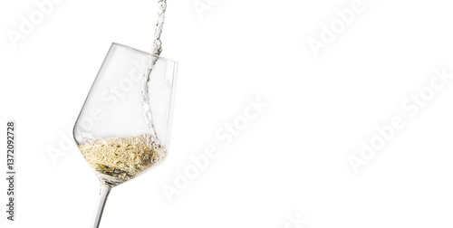 Fotografie A close-up of white wine being poured into a glass, isolated on a white background