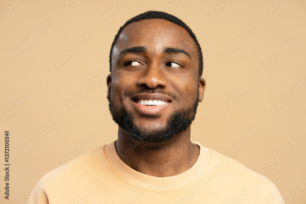 African American man smiling and looking up expressing hope and positivity African American man smiling and looking up expressing hope and positivity