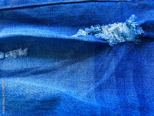 A texture of a ripped denim fabric. Good for any project.