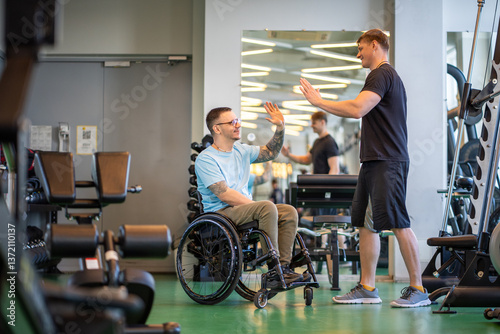 Wallpaper Mural Encouraging personal trainer give high five, supports glad wheelchair athlete on rehabilitation workout in gym. Inclusive fitness program, post accident recovery, adaptive exercise, disabled strength Torontodigital.ca