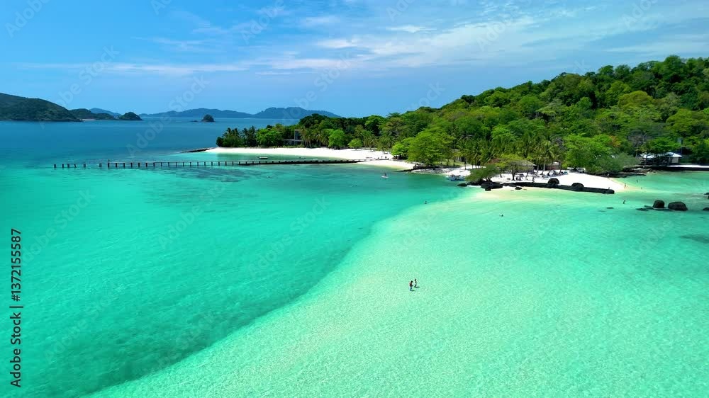Experience the serenity of Koh Kham Island in Thailand, where soft white sands meet crystal-clear turquoise waters. Experience the serenity of Koh Kham Island in Thailand, where soft white sands meet crystal-clear turquoise waters.