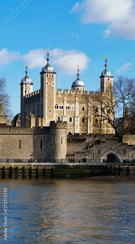 Historic castle on a sunny day by the river.
