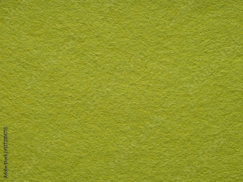 A close-up perspective enhances the vibrant verdancy of the felt, evoking a tranquil, textured solace
