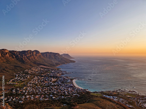Stunning aerial view of Camps Bay and the Twelve Apostles at sunset, Cape Town, South Africa.