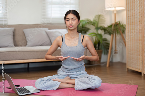 Free Download Meditation and Mindfulness. A woman practicing meditation with focused breathing at home. - GFXLoad
