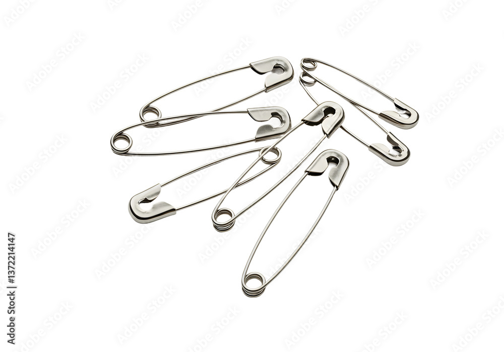 Metal safety pins in classic design, grouped and isolated on pure white background