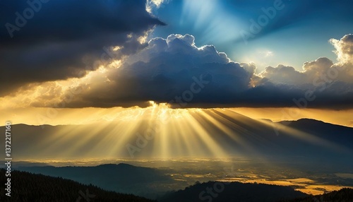 A dramatic cloudscape at dusk with rays of light breaking through, casting a beautiful glow over the landscape below