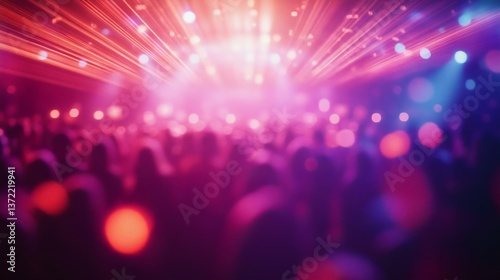 A vibrant concert scene featuring blurred silhouettes of a crowd enjoying dazzling light displays, ideal for music and nightlife themes.
