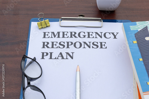 A response plan paper in a clipboard, emphasizing organized workplace emergency preparedness strategies.