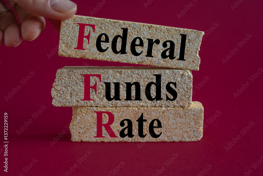 FEDERAL FUNDS RATE symbol. Brick blocks with words FEDERAL FUNDS RATE. Beautiful red background. Businessman hand. Business concept.
