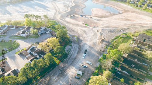 Εκτύπωση καμβά Residential houses and townhomes near construction site with heavy equipment, du