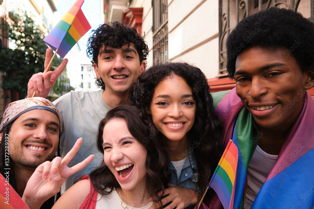 Happy multiethnic friends celebrating gay pride holding rainbow flags and showing peace sign