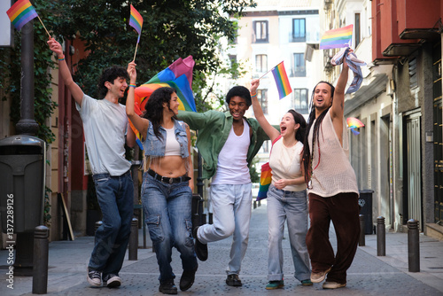 Happy multi ethnic friends dancing together at LGBTQ parade, concept of freedom and equal rights