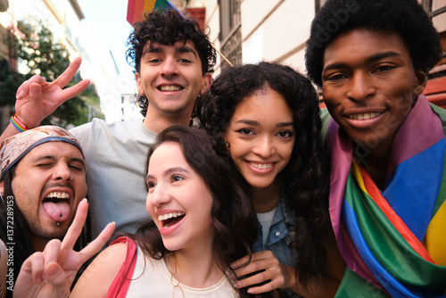Obraz na płótnie Group of happy multi ethnic friends having fun together during LGBT pride parade w salonie