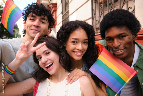 Obraz na płótnie Group of multi ethnic young people taking selfie and showing peace sign while holding rainbow flags at a pride parade w salonie