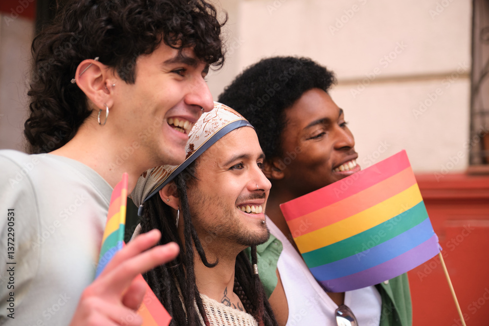 Happy multi ethnic friends waving rainbow flags at pride parade, celebrating diversity and lgbtq plus rights