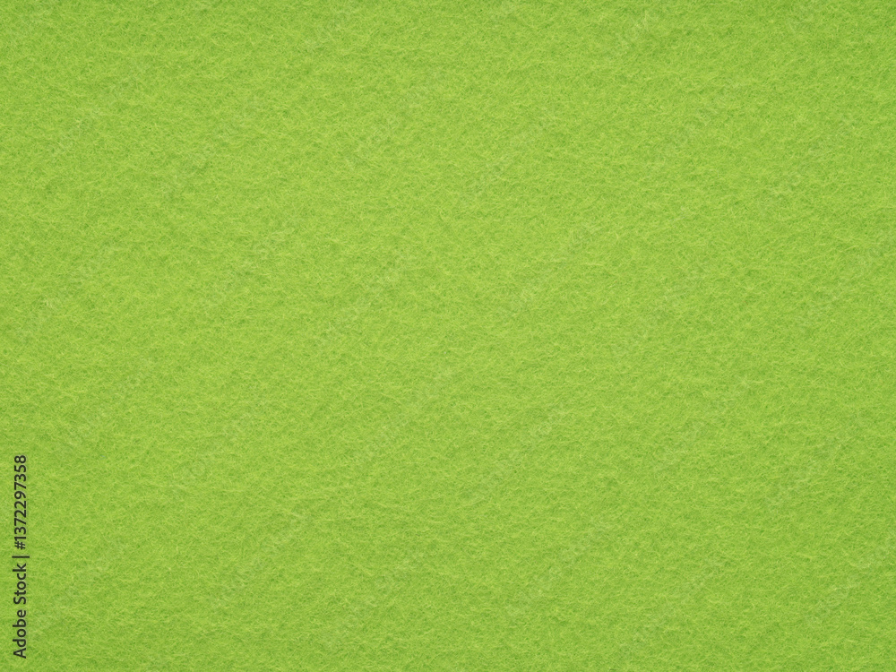 A vibrant burst of lime green, this felt surface is a refreshing ode to the zesty energy of spring
