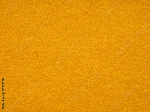 Obraz na płótnie A warm embrace of golden hues, the felt surface radiates a cozy, soft texture and a simplistic, minimalist style w salonie
