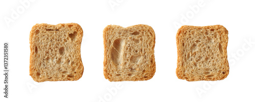 Whole wheat mini toasts, toasted slices of bread or rusks isolated on white background top view	