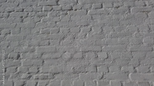 White brick wall background 4k footage, slight pan