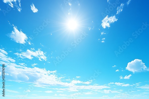 Bright sunlight shining over a beautiful clear blue sky with clouds